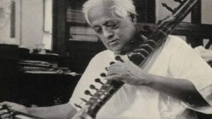 Satyendra Nath Bose playing the Esraj